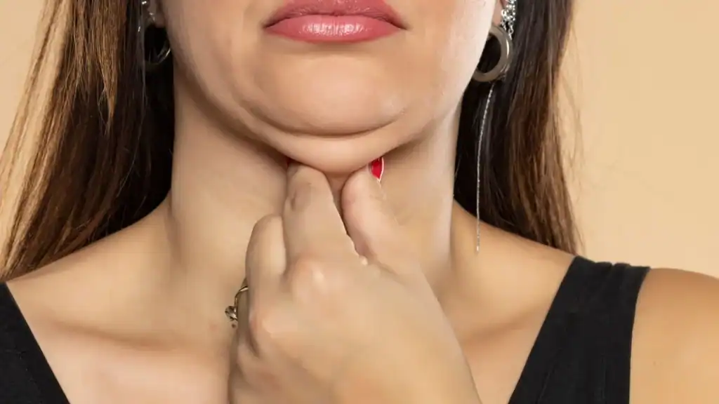An image of a woman with double chin, sad, worried : Non Surgical Double Chin Removal Treatment in Kensington and Chelsea, UK